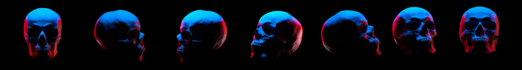 Model of the human skull with red eyes isolated on black background