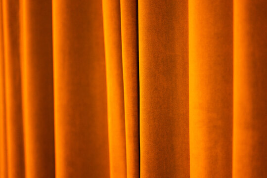 Warm golden velvet curtains abstract background