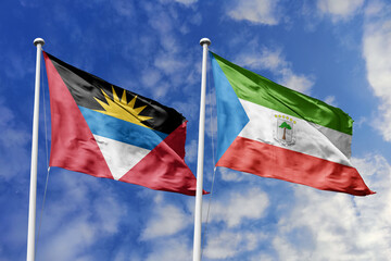  3d illustration. Antigua and Barbuda and Equatorial Guinea Flag waving in sky. High detailed waving flag. 3D render. Waving in sky. Flags fluttered in the cloudy sky.