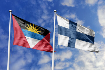  3d illustration. Antigua and Barbuda and Finland Flag waving in sky. High detailed waving flag. 3D render. Waving in sky. Flags fluttered in the cloudy sky.
