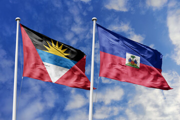  3d illustration. Antigua and Barbuda and Haiti Flag waving in sky. High detailed waving flag. 3D render. Waving in sky. Flags fluttered in the cloudy sky.