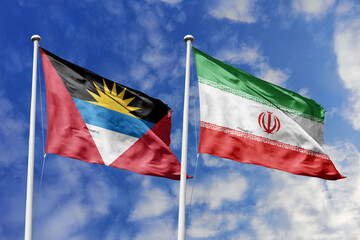  3d illustration. Antigua and Barbuda and Iran  Flag waving in sky. High detailed waving flag. 3D render. Waving in sky. Flags fluttered in the cloudy sky.