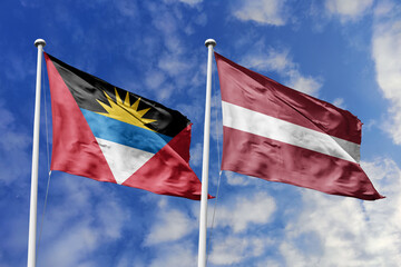 3d illustration. Antigua and Barbuda and Latvia Flag waving in sky. High detailed waving flag. 3D render. Waving in sky. Flags fluttered in the cloudy sky.