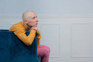 Concerned bald lady sit down look for strength to fight cancer