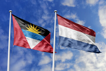 3d illustration. Antigua and Barbuda and Netherlands Flag waving in sky. High detailed waving flag. 3D render. Waving in sky. Flags fluttered in the cloudy sky.
