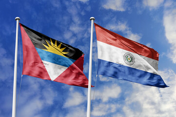 3d illustration. Antigua and Barbuda and Paraguay Flag waving in sky. High detailed waving flag. 3D...