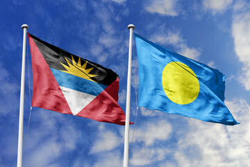 3d illustration. Antigua and Barbuda and Palau Flag waving in sky. High detailed waving flag. 3D...