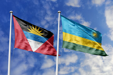 3d illustration. Antigua and Barbuda and Rwanda Flag waving in sky. High detailed waving flag. 3D render. Waving in sky. Flags fluttered in the cloudy sky.