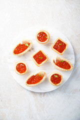 Red caviar served in tartlets