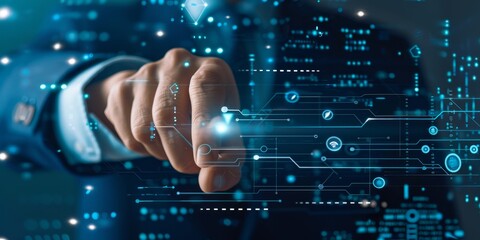 A man is pointing at a computer screen with a blue suit on