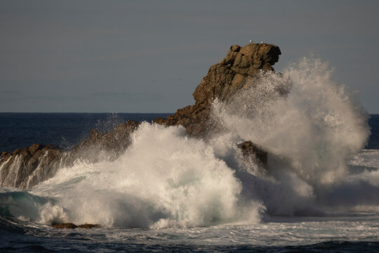 waves crashing on rocks