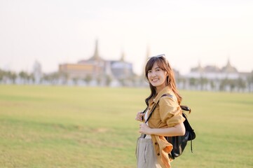 A Traveler Asian woman in her 30s exploring Wat Pra Kaew. From stunning architecture to friendly...