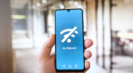 No Network Connection Warning. White male hand in front of office background. 