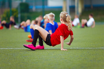 Little School Girl in Sports Training. Kids Having Fun During Physical Education Practice. School...