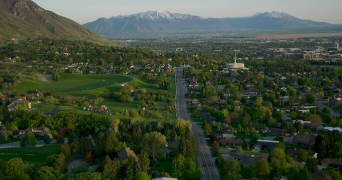 Aerial drone footage sweeping over Provo, Utah, showcasing the scenic landscape and urban layout from a bird's-eye view
