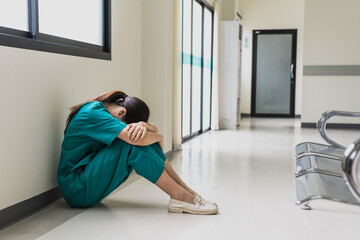 Asian female nurse feeling depress with hospital work