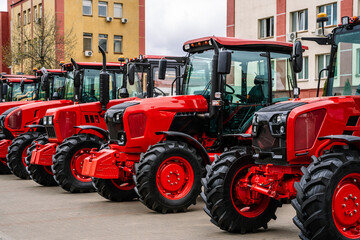 Tractors on farm production. New agricultural tractors are sold for work in the field