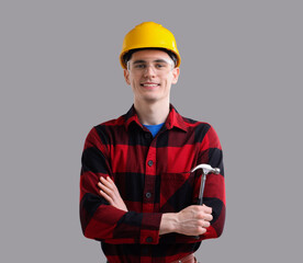 Professional repairman holding hammer on light grey background