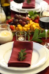 Stylish table setting with burning candles. Romantic dinner