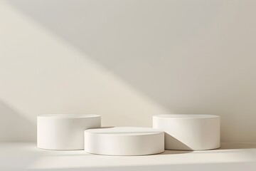 Three White Cylindrical Podiums of Varying Heights on an Off White Background for Product Showcase