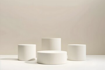 Three Minimalist White Cylindrical Podiums of Varying Heights on an Off White Background