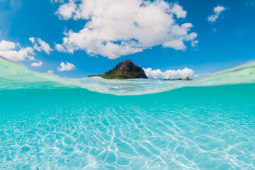 Turquoise sea and Le Morne mountain in Mauritius. Split view
