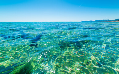 Turquoise water and blue sky in Piscina Rei beach