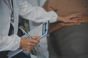 Cropped shot of a female nurse hold her senior patient's hand. Giving Support. Doctor helping old...