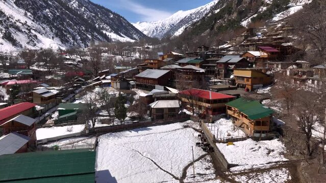Scenic Kalasha Village in Bamburet Valley in North Pakistan at Winter. Aerial View Hindu Kush Muntain Range Himalayas.