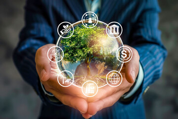 Environmental, social, and governance, sustainable organization development and investment concept. ESG management icons with renewable energy symbols on tree inside glass globe in businessman hand.