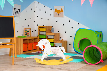 Interior of playroom in kindergarten with toys