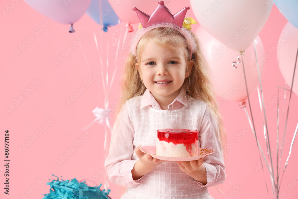 Wall mural cute little girl in crown with birthday cake and balloons on pink background