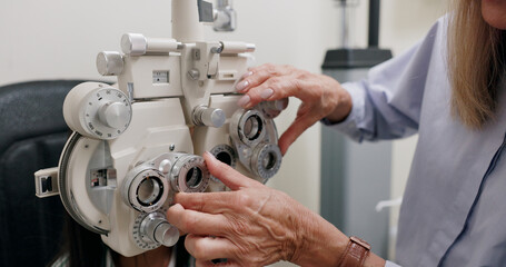 Child, machine and eye test for vision in clinic with ophthalmology, optical assessment and healthcare service. Check for eyes, phoropter and girl patient with myopia and medical exam for insurance