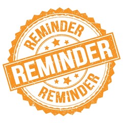 REMINDER text on orange round stamp sign