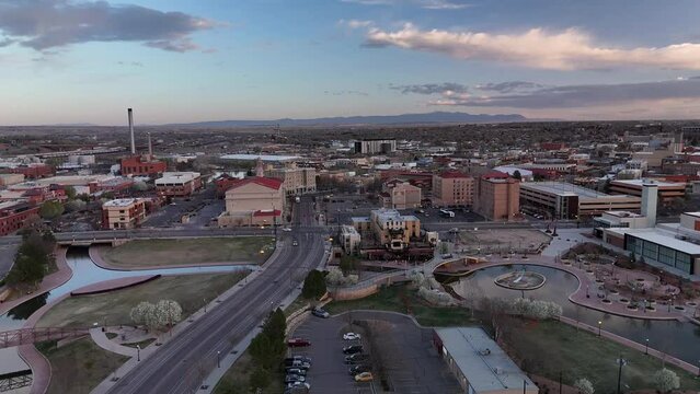 Early morning 4k aerial footage of downtown Pueblo, Colorado over I25 with mountains in the distance.