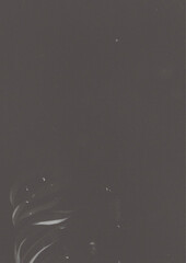 black and white splashes on black background