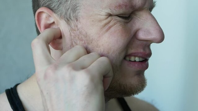 The man doesn't hear anything. People have a problem with hearing, a person has lost their hearing, the eardrum has burst.