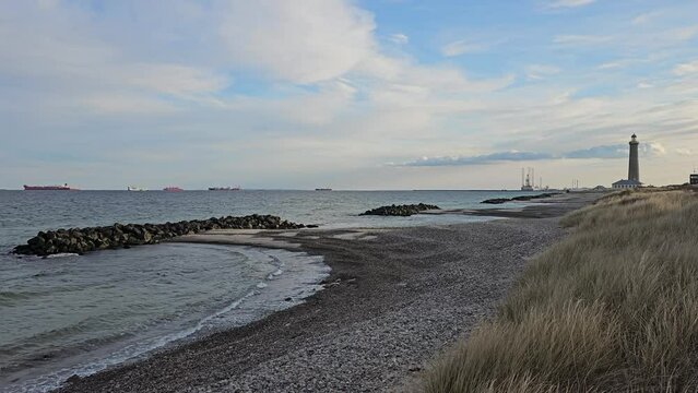 Beach with lighthouse in Skagen, Denmark