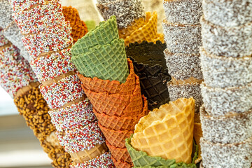 empty ice cream cones assortment collection at shop on a street, Empty ice cream waffle or wafer...