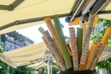 empty ice cream cones assortment collection at shop on a street, Empty ice cream waffle or wafer cones