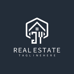 initial monogram logo for real estate with building shape creative design	
