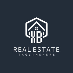 initial monogram logo for real estate with building shape creative design	
