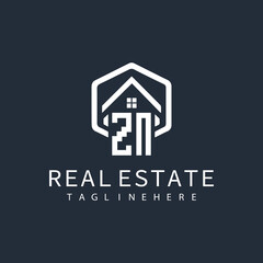 initial monogram logo for real estate with building shape creative design	
