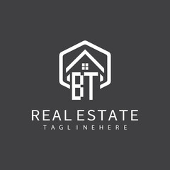 initial monogram logo for real estate with building shape creative design	
