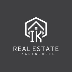 initial monogram logo for real estate with building shape creative design	

