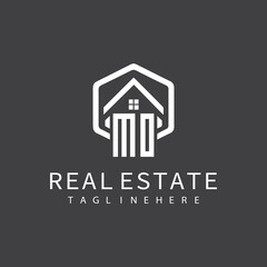 initial monogram logo for real estate with building shape creative design	
