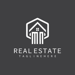 initial monogram logo for real estate with building shape creative design	
