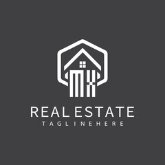 initial monogram logo for real estate with building shape creative design	
