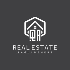 initial monogram logo for real estate with building shape creative design	
