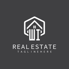 initial monogram logo for real estate with building shape creative design	
